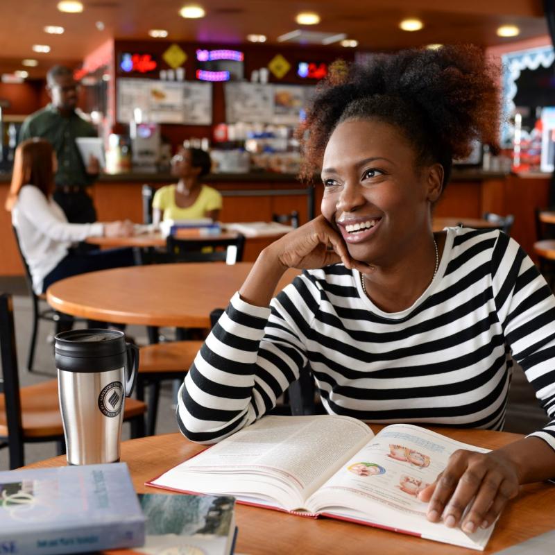 Woman at cafe studying