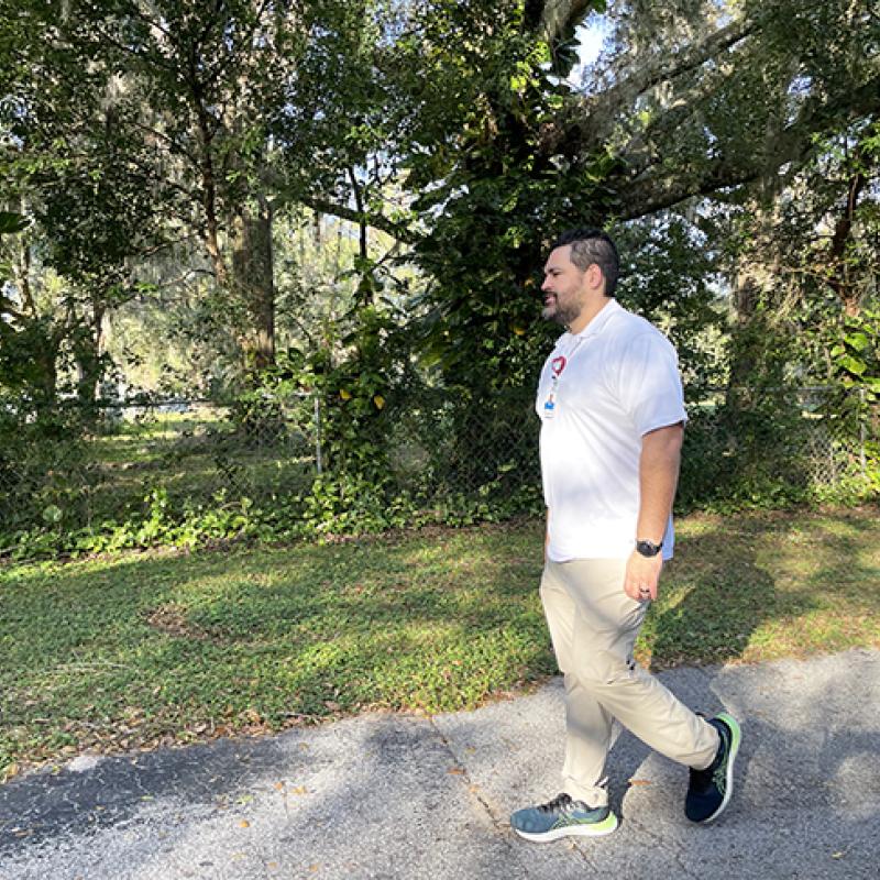 Kenny Torres Cruz walking outdoors