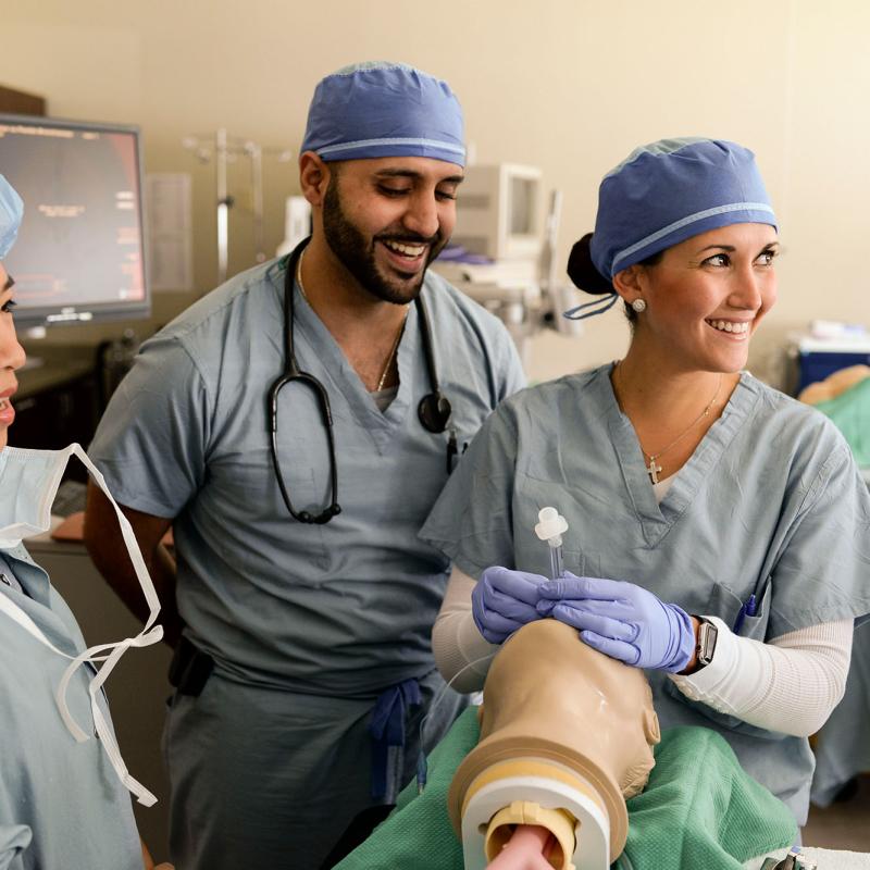 Nurse anesthesia students practicing intubation procedures in the skills lab