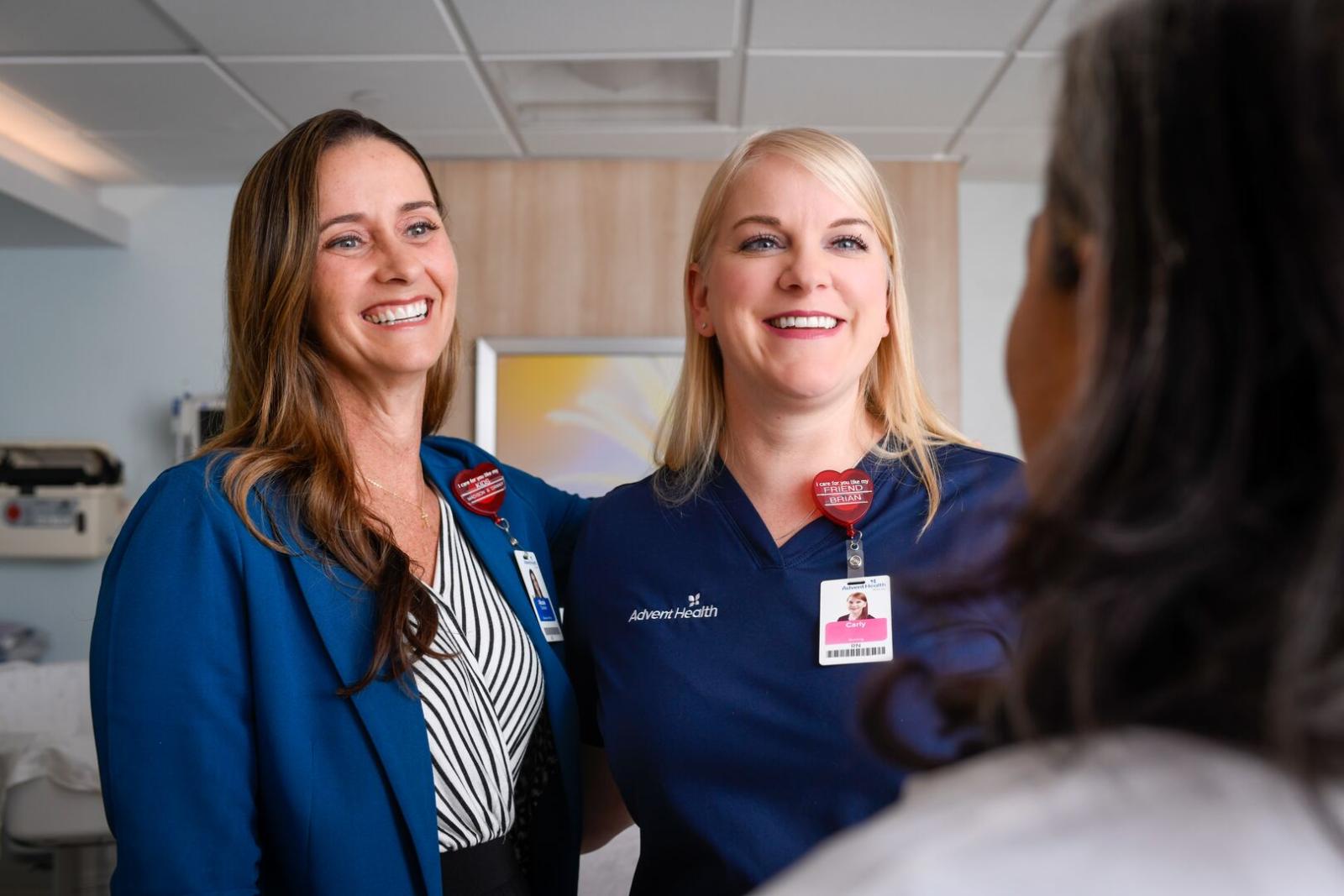 Two nursing leaders smiling in hospital room